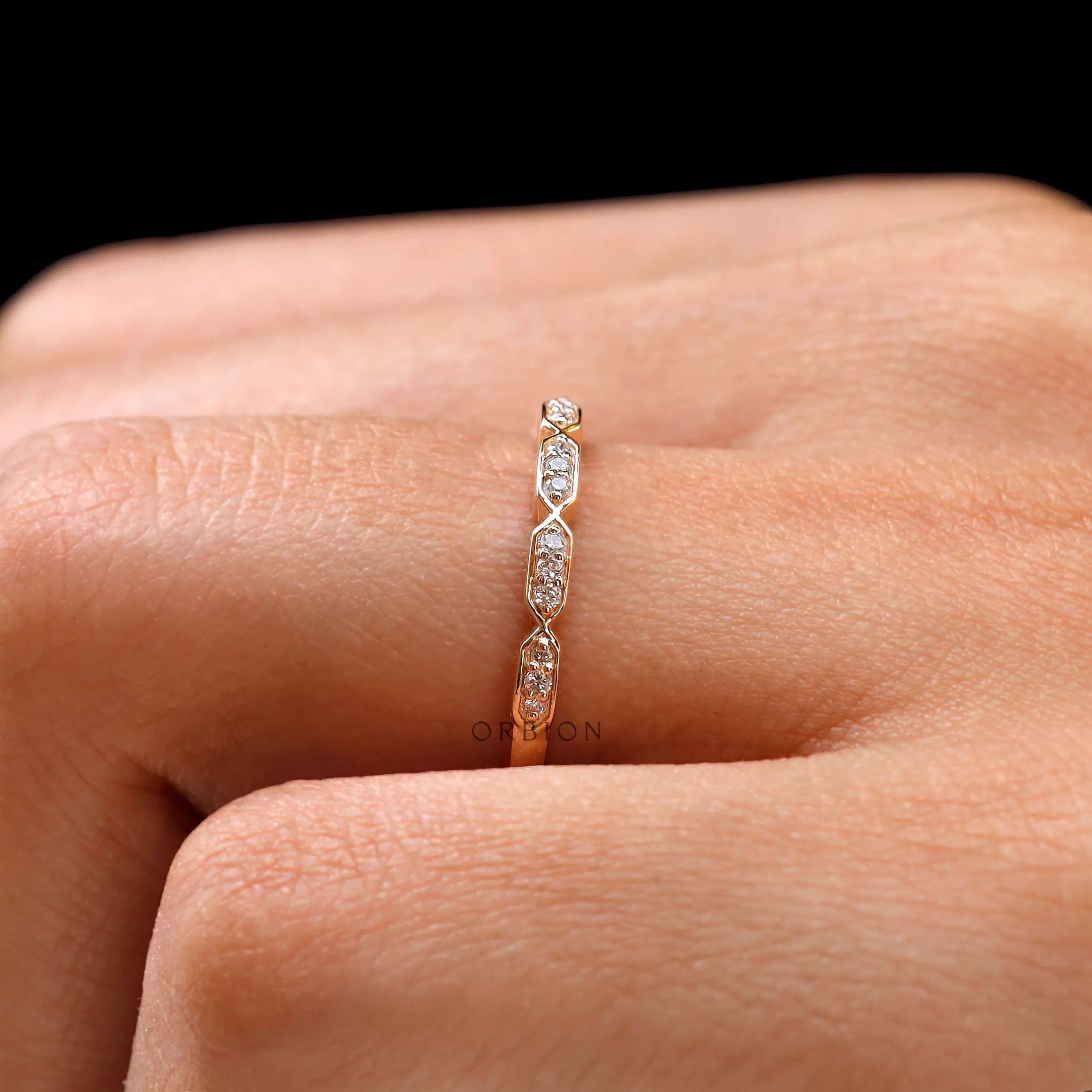 Close-up of hexagon shaped diamond details on dainty stacking band