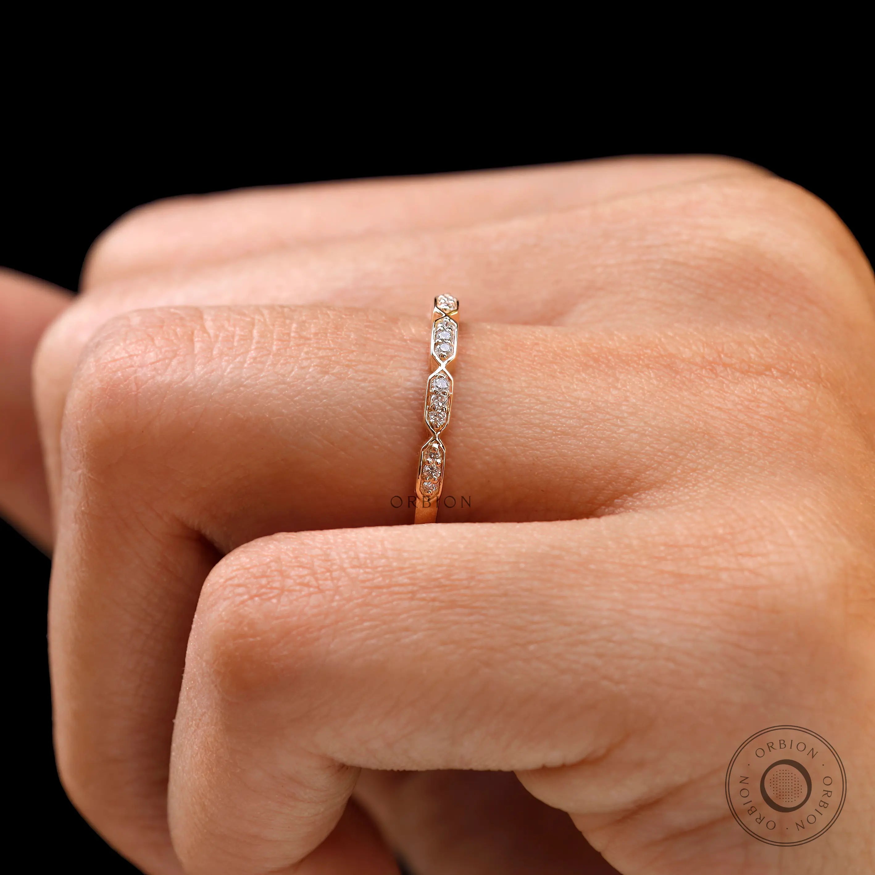 Close-up of hexagon shaped diamond details on dainty stacking band