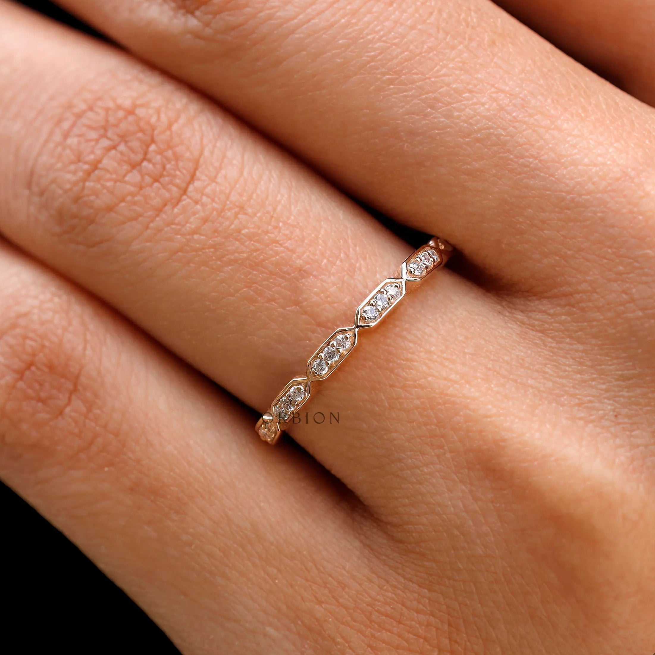 Minimal hexagon moissanite diamond band styled as wedding stacking ring