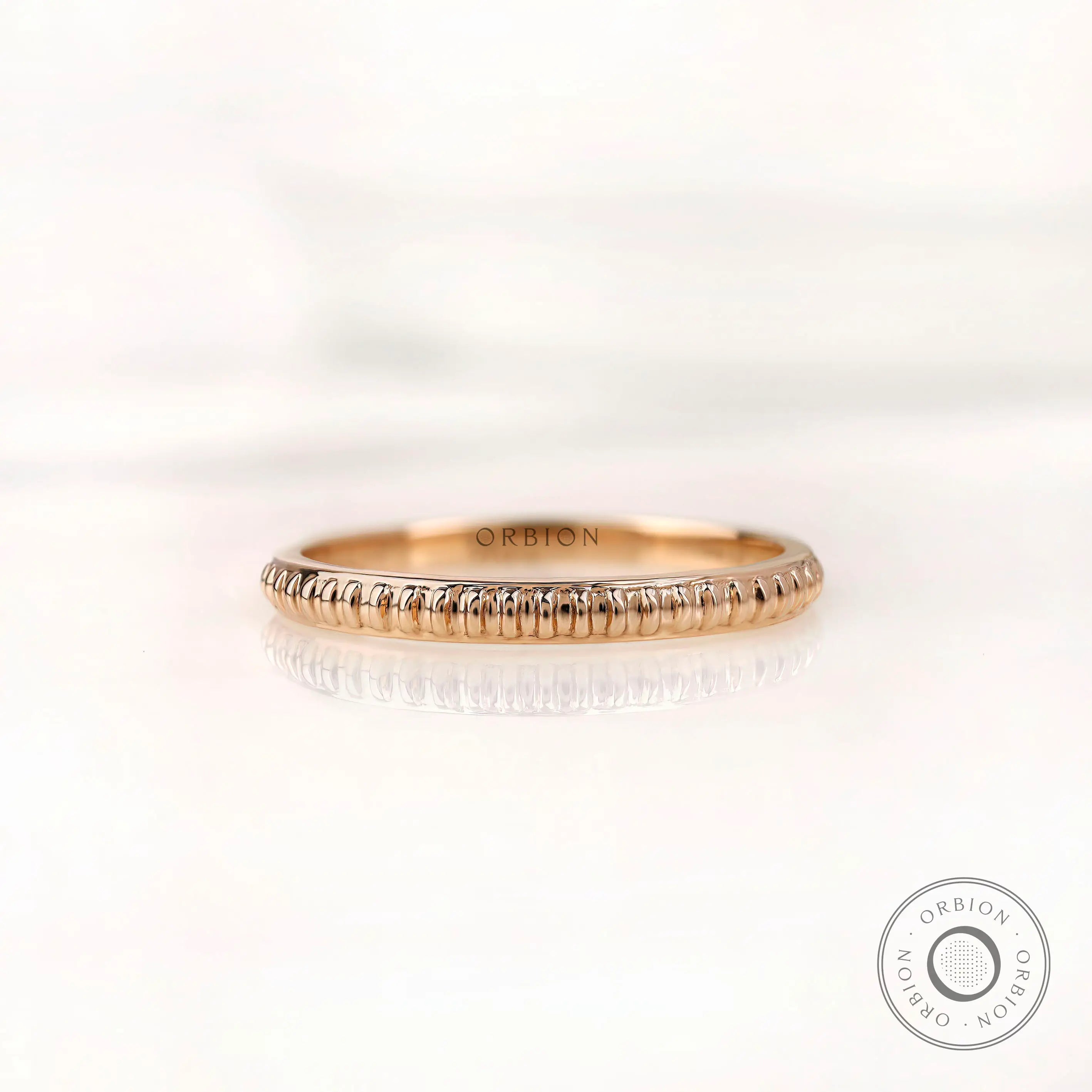 Fluted textured thin wedding band, front view