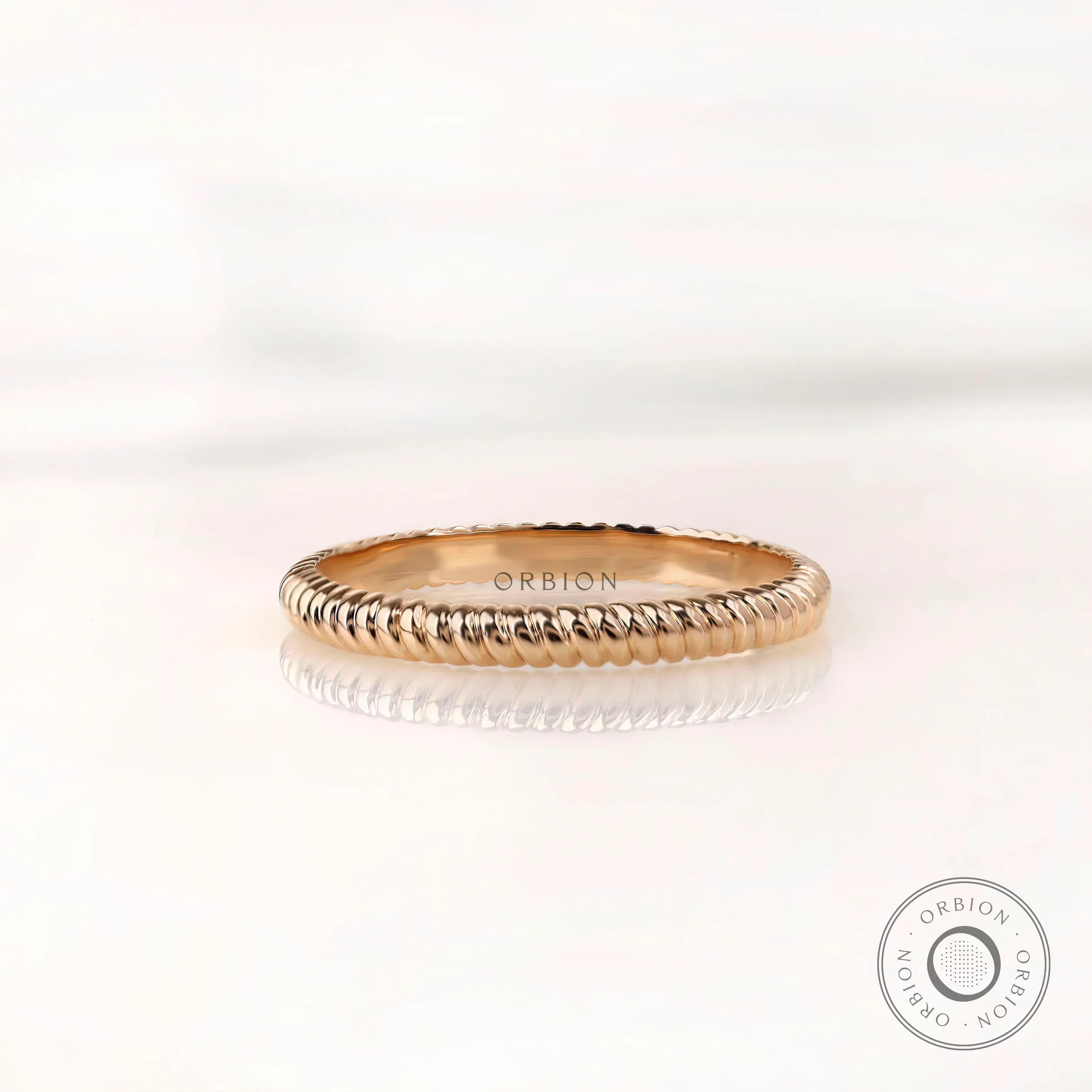 Twisted gold eternity wedding band in 10K yellow gold, front view