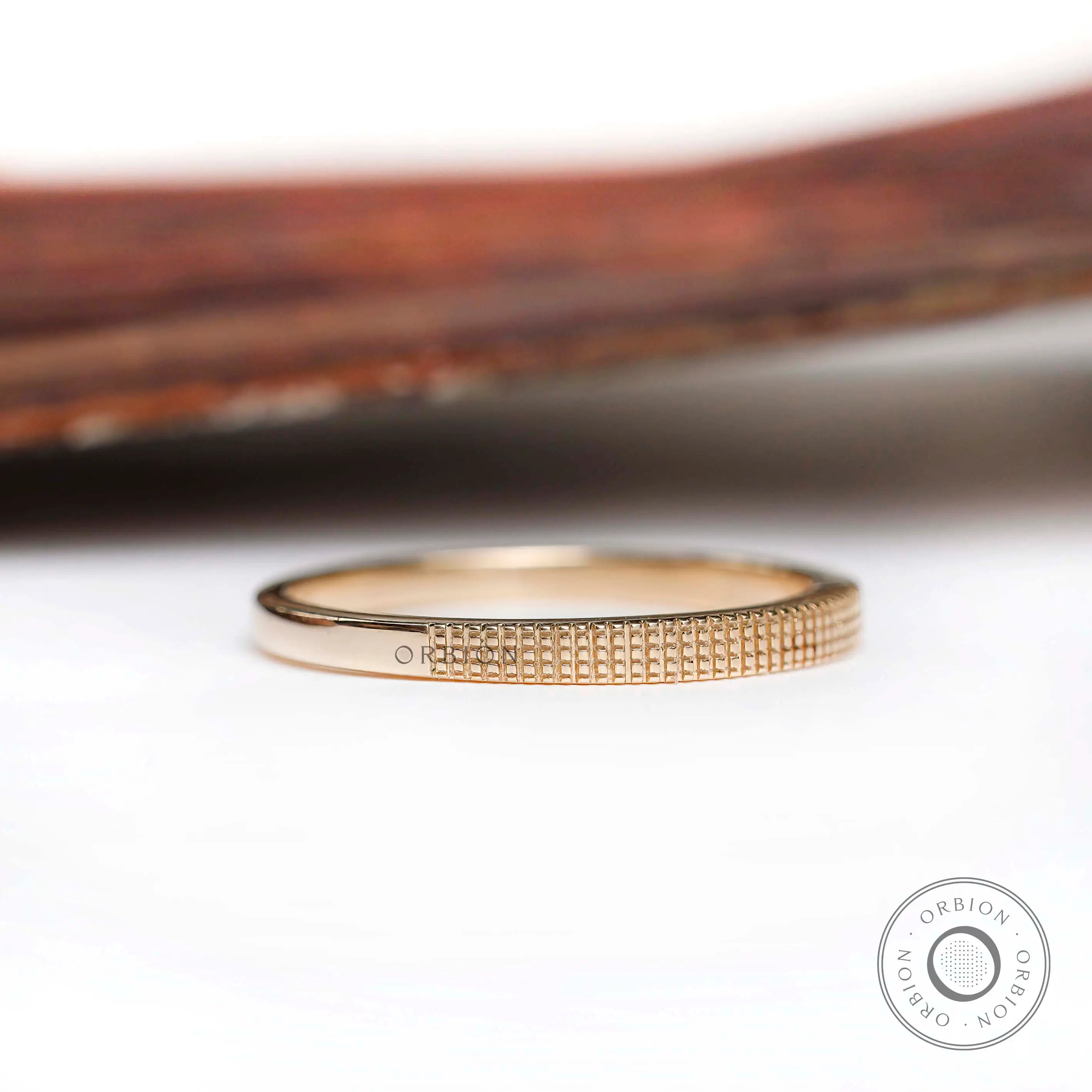 Classic thin band with half lattice texture, angled front view