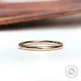 Simple thin plain yellow gold band front view