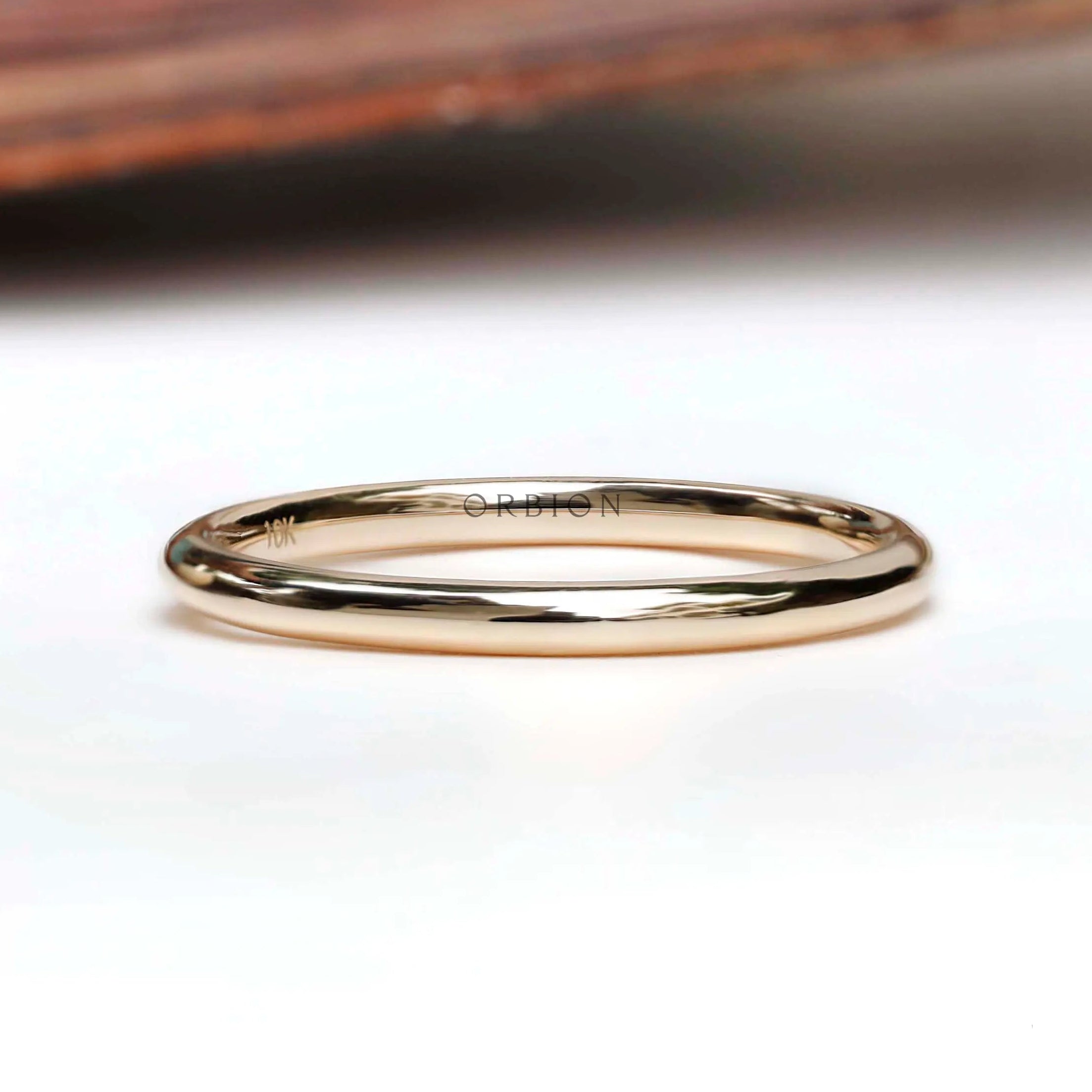Simple thin plain yellow gold band front view