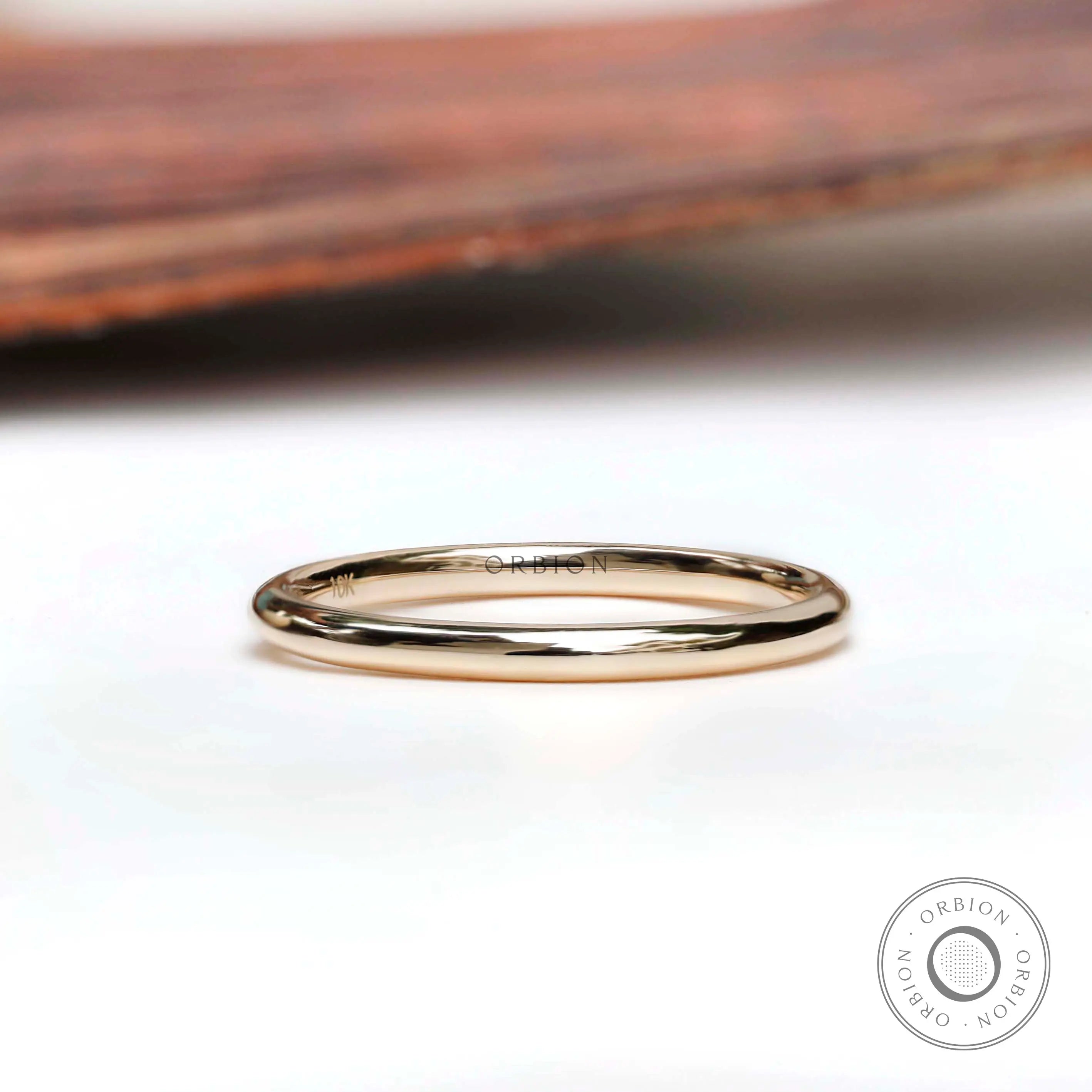 Simple thin plain yellow gold band front view
