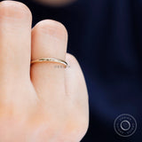 Minimal thin plain yellow gold ring lifestyle view