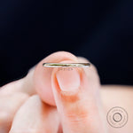 Close up of thin plain polished gold band