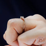Slim rose gold nesting band with marquise moissanites shown from side angle