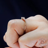 Slim rose gold nesting band with marquise moissanites shown from side angle
