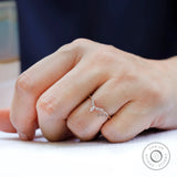 Marquise and round cut moissanite wedding band worn on finger lifestyle view