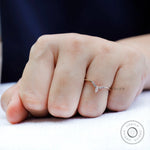 Close up of chevron contour moissanite band highlighting prong setting