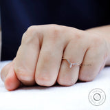 Close up of chevron contour moissanite band highlighting prong setting