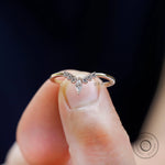 Minimal chevron moissanite contour band showcasing slim gold shank