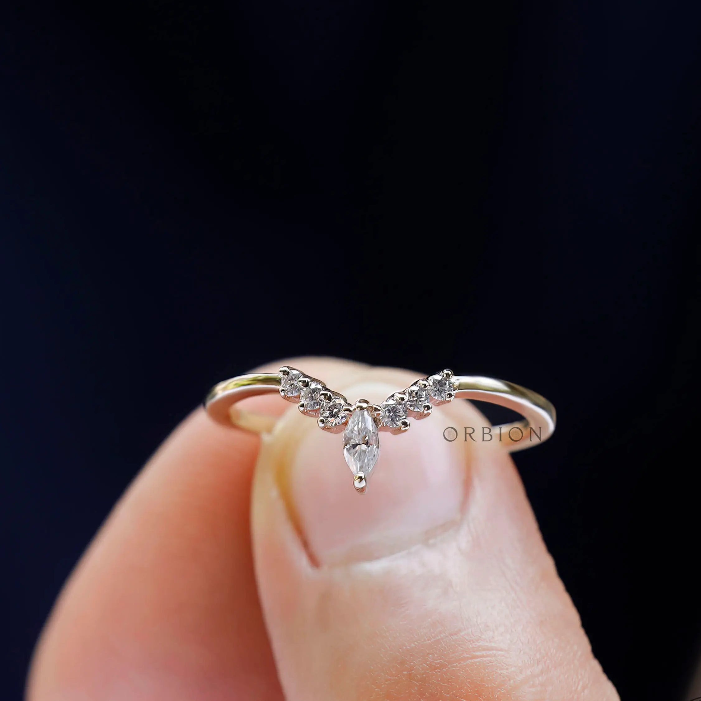 Minimal chevron moissanite contour band showcasing slim gold shank