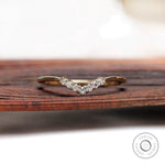 Simple thin chevron moissanite band front view