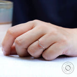 On hand view of thin moissanite chevron ring