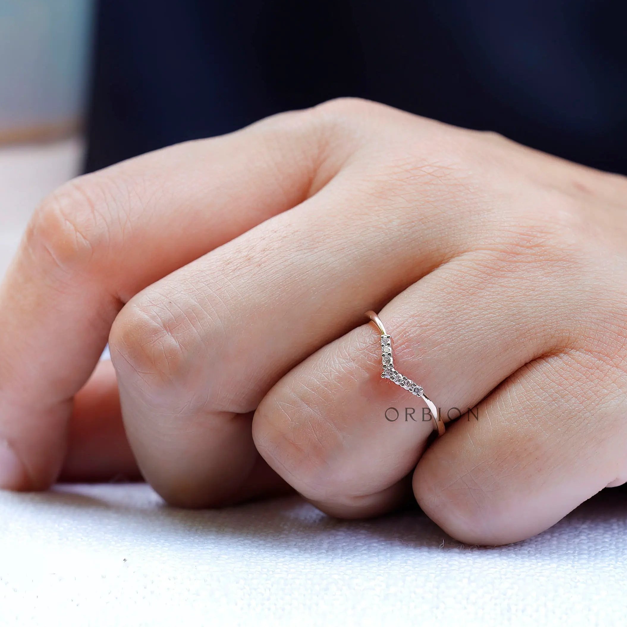 On hand view of thin moissanite chevron ring