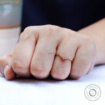 Minimal V shaped moissanite band worn on hand