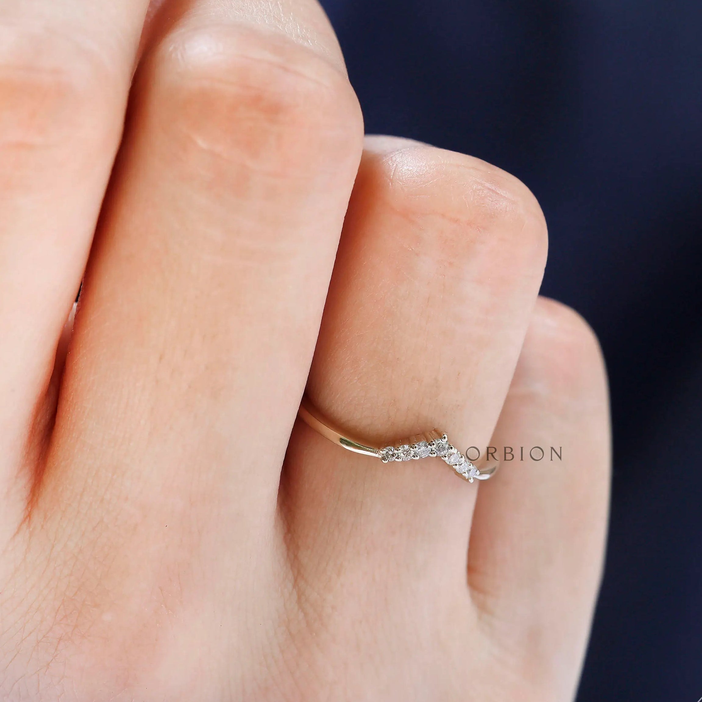 Close up of small round moissanite chevron detail