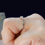 Side view of chevron wedding band with smooth polished band on hand