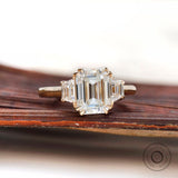 Stunning Emerald Three Stone Moissanite Ring - Perfect for Proposing! Elegant Trilogy Moissanite Ring with Trapezoid Accents