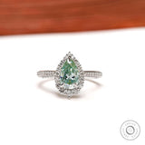 Elegant Light Green Moissanite Halo Ring in White Gold - Perfect for Proposals Unique and Sparkling Pear Cut Design, A Timeless Choice