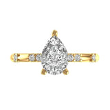Pear cut hidden halo engagement ring in yellow gold