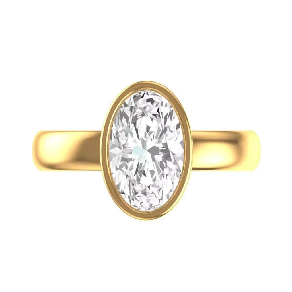 Old mine cut oval bezel set engagement ring in yellow gold