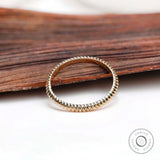 Elegant Twisted Gold Ring for a Dazzling Wedding Look, Chic Gold Eternity Band with a Unique Twist, A Modern Wedding Essential