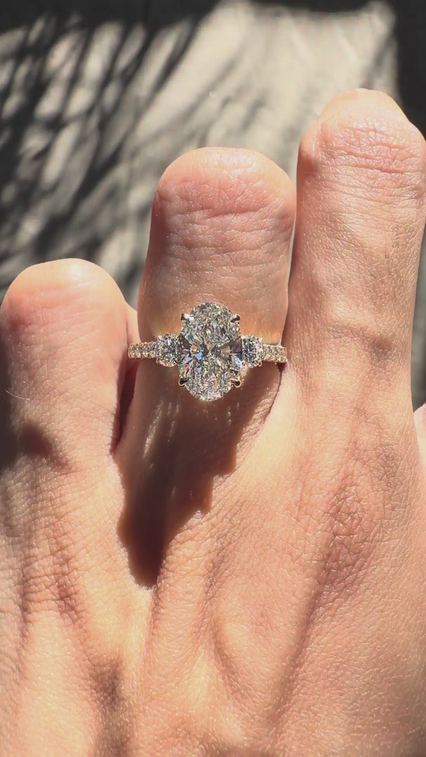 Oval lab grown diamond or moissanite three stone engagement ring yellow gold