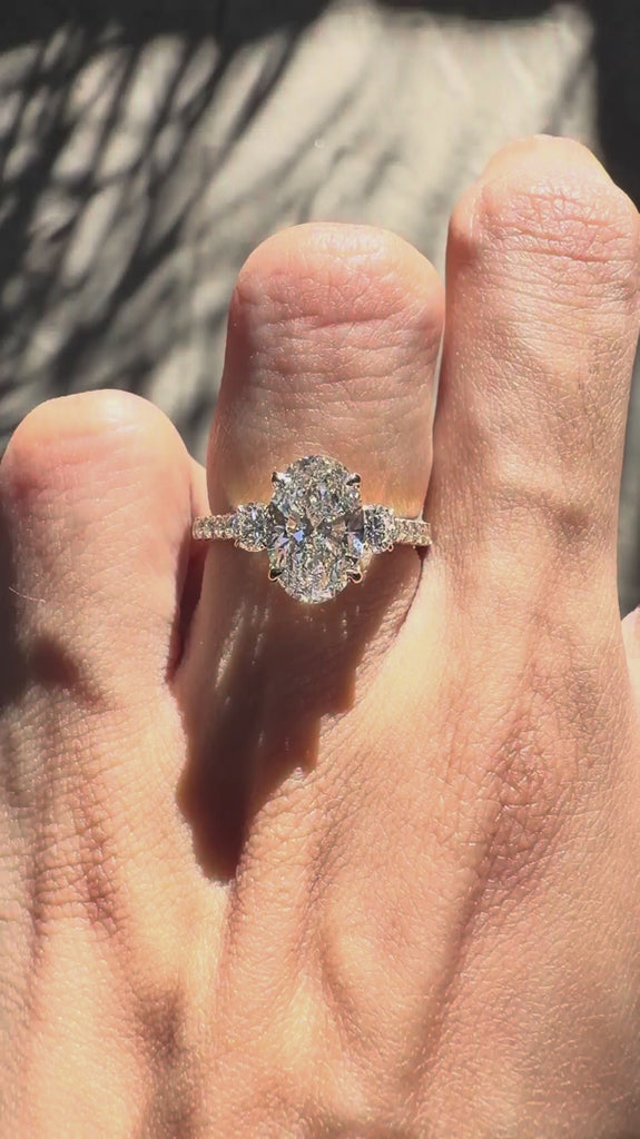 Oval lab grown diamond or moissanite three stone engagement ring yellow gold
