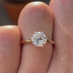 A close-up view of the Old European Cut Moissanite solitaire engagement ring, set in dual-tone 10K yellow-white gold