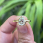 Pear moissanite solitaire ring rotating to show details