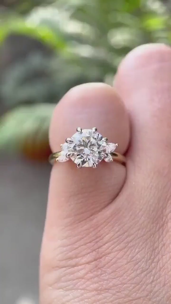 Rotating video of round cut lab grown diamond cluster ring in 18K dual tone gold