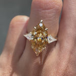 Marquise champagne three stone cathedral engagement ring yellow gold