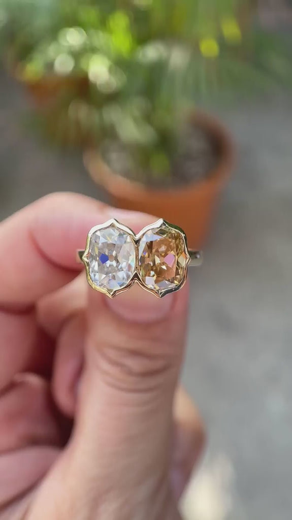 Dual elongated cushion Old Mine Cut moissanite bezel set Toi et Moi ring in 10K yellow gold rotating view