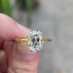 Elongated cushion Old Mine Cut moissanite solitaire engagement ring in 10K yellow gold detailed rotating view showing six-prong setting and slim band profile