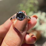 Round Old European cut bluish grey moissanite engagement ring rotating view
