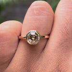Dark champagne moissanite octagon ring on hand in 10k yellow gold bezel setting video