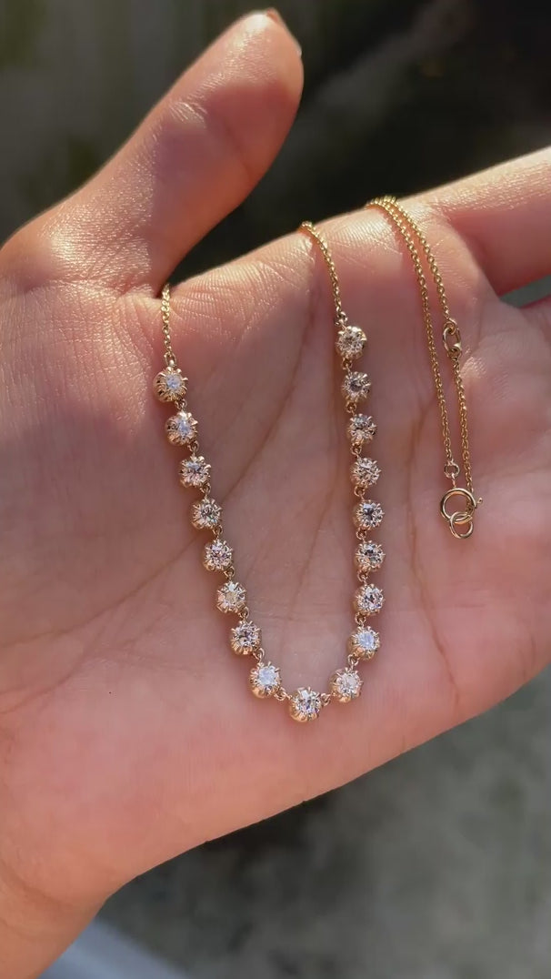 Old european cut round diamond necklace close up antique sparkle