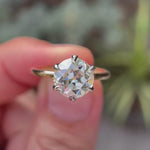 360-degree view of Six Prong Solitaire OEC Moissanite Ring in Dual Tone.