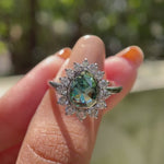 Pear rose cut moissanite halo ring in natural light rotation