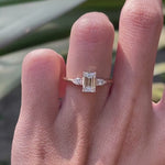 Emerald cut center with pear side stones engagement ring yellow gold video