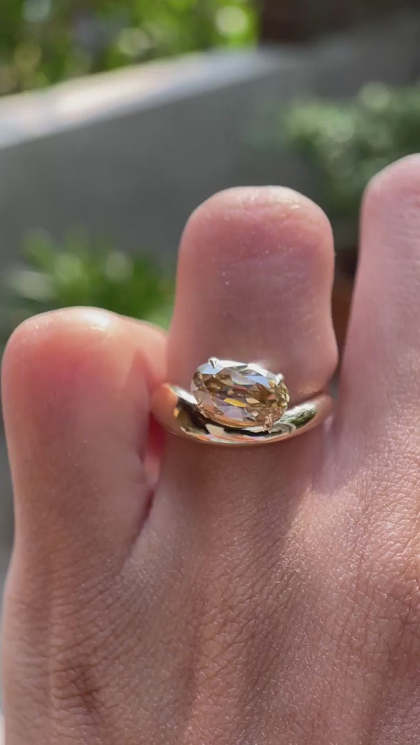 Elongated oval old mine cut champagne moissanite solitaire ring on hand video