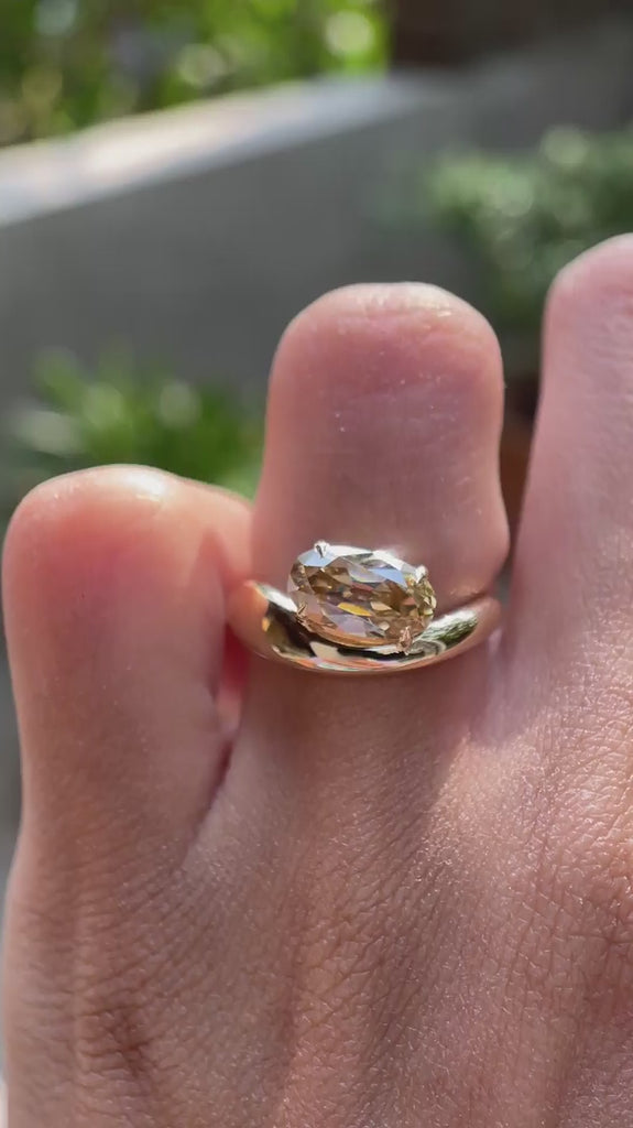 Elongated oval old mine cut champagne moissanite solitaire ring on hand video
