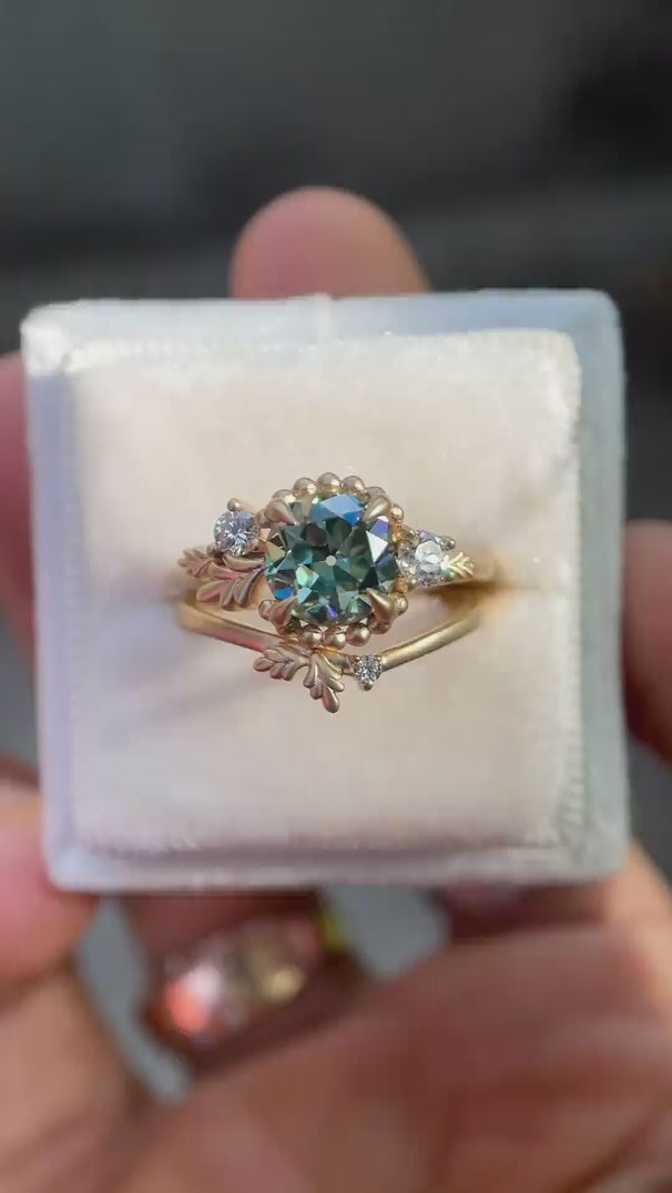 Rotating view of nature inspired ring set on soft white box