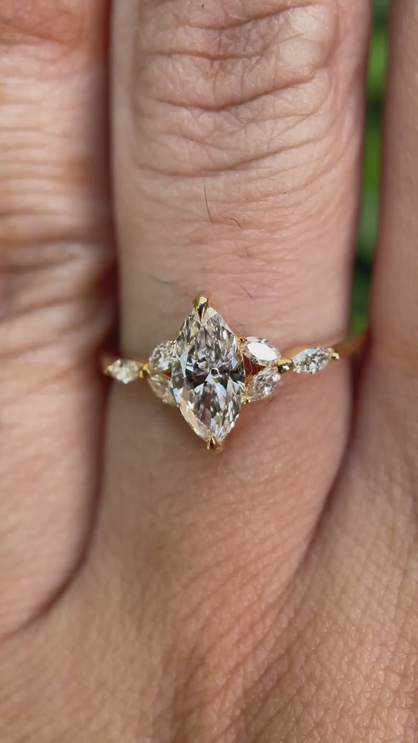 Marquise lab grown diamond cluster engagement ring in 14K yellow gold shown from multiple angles