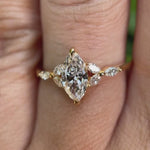 Marquise lab grown diamond cluster engagement ring in 14K yellow gold shown from multiple angles