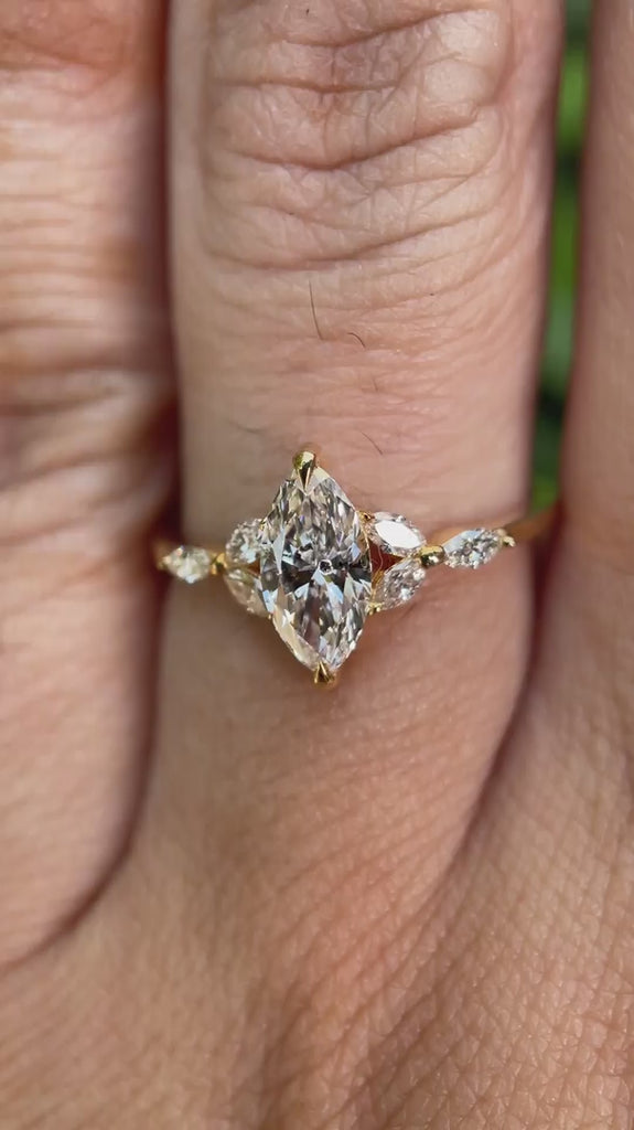 Marquise lab grown diamond cluster engagement ring in 14K yellow gold shown from multiple angles