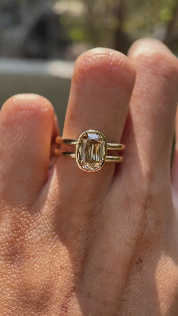 Elongated cushion champagne moissanite double shank ring rotating view